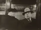 Helen Levitt, Subway Portrait (woman looking at man in hat)