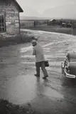 W. Eugene Smith, Ernest Ceriani on his way to a house call in foul weather, Kremmling, Colorado