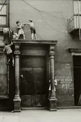 Helen Levitt, N.Y.C. (kids fighting over door), circa 1940, Gelatin silver print, printed later