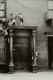 Helen Levitt, N.Y.C. (kids fighting over door)