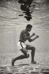 Ali Underwater by Flip Schulke, 1961, Gelatin silver print, printed later, mounted, sold Apr 2024