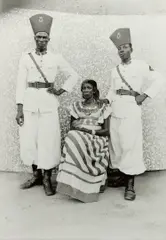 Untitled (woman with Republican guards in leave uniforms) by Seydou Keïta, 1956-1957, Gelatin silver print, printed 1998, sold Oct 2024