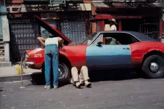 New York (man under car hood) by Helen Levitt, 1976, Chromogenic print, sold Dec 2024