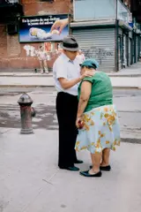 New York (man consoling woman) by Helen Levitt, circa 1974, Chromogenic print, sold Dec 2024