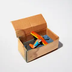 Im Meer (Into the Sea) (D. 1970.4) by Dieter Roth, 1970, Sheet metal toy airplane and cast sugar with blue acrylic paint, and cardboard box multiple, sold Feb 2023