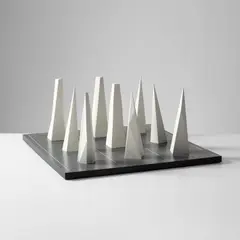 Nine Pyramids on a Nine-Part Grid by Sol LeWitt, 1991, White painted cast polyurethane resin multiples, on a grey painted Formica base, sold Apr 2023