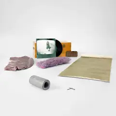 Various Artists, 7 Objects/69, 1969, The set of six multiples, including a painting on canvas with two nails, bronze sidewalk plaque, vinyl record with screenprinted jacket, reprocessed nylon net multiple, lead multiple and a plaster multiple cast in satin, all contained in the original wooden box with brass clasps, lacking the Eva Hesse