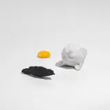 Kiki Smith, Yolk; Bird; and Cat (W. 91 & 111), 1999, A cast glass multiple, a cast patinated bronze multiple with two emeralds and a cast porcelain multiple