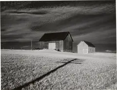 Two Barns and Shadow by Minor White, 1955, Gelatin silver print, sold Apr 2023