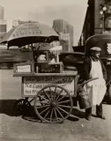 Hot Dog Stand, West and North Moore Streets, Manhattan by Berenice Abbott, 1936, Gelatin silver print, sold Oct 2023