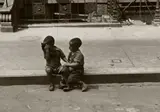 Helen Levitt, New York (two boys sitting)