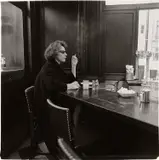 Diane Arbus, Woman at counter smoking, N.Y.C.