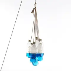 Tony Feher, Untitled, 1997–1998, plastic bottles, water, food dye and rope, in 10 parts