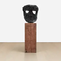 Bronze Wall Mask I by Thomas Houseago, 2005, bronze on redwood pedestal, sold May 2022