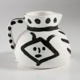 Têtes (Heads) (R. 368) by Pablo Picasso, 1956, White earthenware turned pitcher painted in black, white and green, with partial brushed glaze; ceramic, Madoura edition, sold Apr 2022