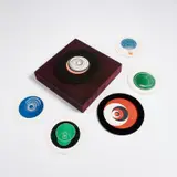Marcel Duchamp, Rotoreliefs (Optical Disks) (S. 441c), 1935/1963, The complete set of 12 offset lithographs in colors, on six double-sided round card disks, all contained in the original round, black plastic with two magnetized and foam frames in different widths, to be viewed as they rotate at 33 1/3 revolutions per minute on the velvet-covered wall-mounted turntable designed by Duchamp