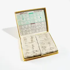 Untitled (Whitman's Sampler) by Andy Warhol, 1982, Two cement blocks wrapped in cellophane, contained in a Whitman's Sampler cardboard candy box, with original cellophane , sold Oct 2022