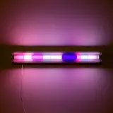 Spencer Finch, Moonlight (Luna County, New Mexico, July 13, 2003), 2003, Fluorescent light fixture, nine colored filters adhered to a fluorescent tube light (as issued), with an accompanying extra set of filters