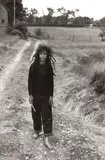 Diane Arbus, Girl Walking on a Dirt Road, Shelter Island, N.Y.