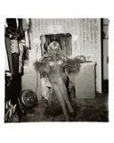 Topless Dancer In Her Dressing Room, San Francisco, Cal. by Diane Arbus, 1968, Gelatin silver print, printed later by Neil Selkirk, sold Oct 2022