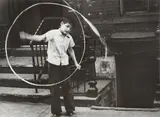 N.Y. (boy spinning ribbon) by Helen Levitt, circa 1945, Gelatin silver print, probably printed in the 1950s, sold Oct 2022