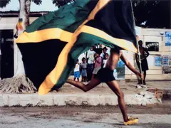 Hank Willis Thomas, An Unidentified Jamaican Boy Uses the Puma H Street Running Shoe to Run for His Freedom, 2003-2006, Chromogenic print