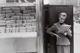 Louis Stettner, Elbowing Out of Town Newsstand, NYC