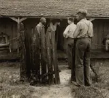Paul Taylor with Farm Workers, Alabama by Dorothea Lange, 1936, Gelatin silver print, sold Oct 2022