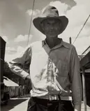 Man in Hat on Street, Oklahoma by Dorothea Lange, 1938, Gelatin silver print, probably printed 1950's, sold Oct 2022