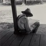 Man on Porch Reading Paper by Dorothea Lange, 1938, Gelatin silver print, printed later, sold Oct 2022
