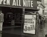 Drunk Drivers Go To Jail by Dorothea Lange, circa 1955, Gelatin silver print, offered Oct 2022