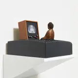 Enlightenment Compressed by Nam June Paik, 1994, color LCD TV, video camera, wood TV cabinet, plastic TV case, bronze Buddha, aquarium stones and paint, sold Nov 2021