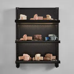Josh Kline, Stories, 2016, 9 cast silicone cameras, 4 metal handcuffs, 1 3D-printed plaster camera, inkjet ink, cyanoacrylate, commercial shelving with LED lights and power cable