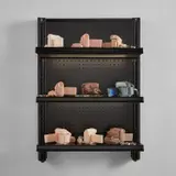 Josh Kline, Stories, 2016, 9 cast silicone cameras, 4 metal handcuffs, 1 3D-printed plaster camera, inkjet ink, cyanoacrylate, commercial shelving with LED lights and power cable