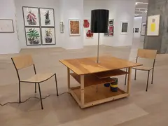 Franz West, Creativity: Furniture Reversal, 1998, 2 chairs, table, lamp, various coloured fabric tapes, DVD, and videocassette