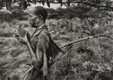 Bushman, Botswana (holding bird), Africa by Sebastião Salgado, 2008, Gelatin silver print, printed later, sold Apr 2021