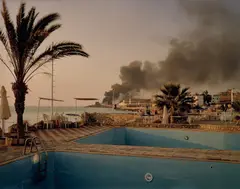 Simon Norfolk, Storage Depot for Power Station Jiyeh, from Sand’s Rock Resort, Lebanon, 2006, Chromogenic print