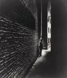 Policeman in a Dockland Alley, Bermondsey by Bill Brandt, 1938, Gelatin silver print, printed later, sold Apr 2021