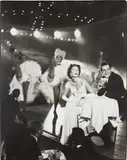 Suzy Parker and Robin Tattersall, Evening dress by Grès, Moulin Rouge, Paris, August by Richard Avedon, 1957, Gelatin silver print, printed 1977, sold Oct 2021