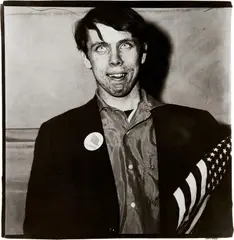 Diane Arbus, Patriotic Young Man with a Flag, N.Y.C., 1967, Gelatin silver print, flush-mounted