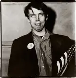 Patriotic Young Man with a Flag, N.Y.C. by Diane Arbus, 1967, Gelatin silver print, flush-mounted, sold Oct 2021