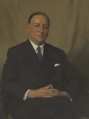 Herbert James Gunn, Portrait of a man, half-length seated, in a grey suit and tie, oil on canvas