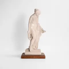 Stanley Nicholson Babb, Untitled, a pottery figure of a female nude holding an oil lamp