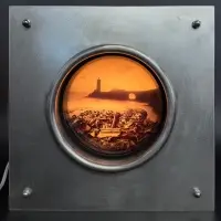François Delebecque, Les Hublots (Porthole), Mixed media, metal image slide projector