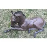 Pat Mathiesen, Untitled, Recumbent foal life size bronze sculpture, signed, dated 1990 and numbered 2 of 10