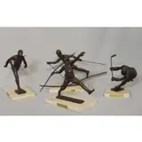 Sterett-Gittings Kelsey, Untitled, 4 Bronze Royal Copenhagen numbered edition sporting sculptures on marble bases