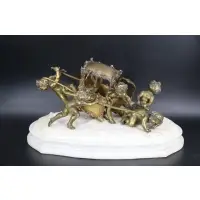 Louis Gossin, Untitled, Gilt bronze sculpture of Putti with sedan chair on a white marble base