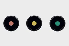 Christian Marclay, Three Framed Grooveless Records with Colored Labels, 1987, vinyl and paper, in artist's frame, in 3 parts