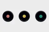 Christian Marclay, Three Framed Grooveless Records with Colored Labels, 1987, vinyl and paper, in artist's frame, in 3 parts