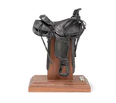 My Saddle by Fred Fellows, 1983, bronze with dark brown patina, sold Feb 2019